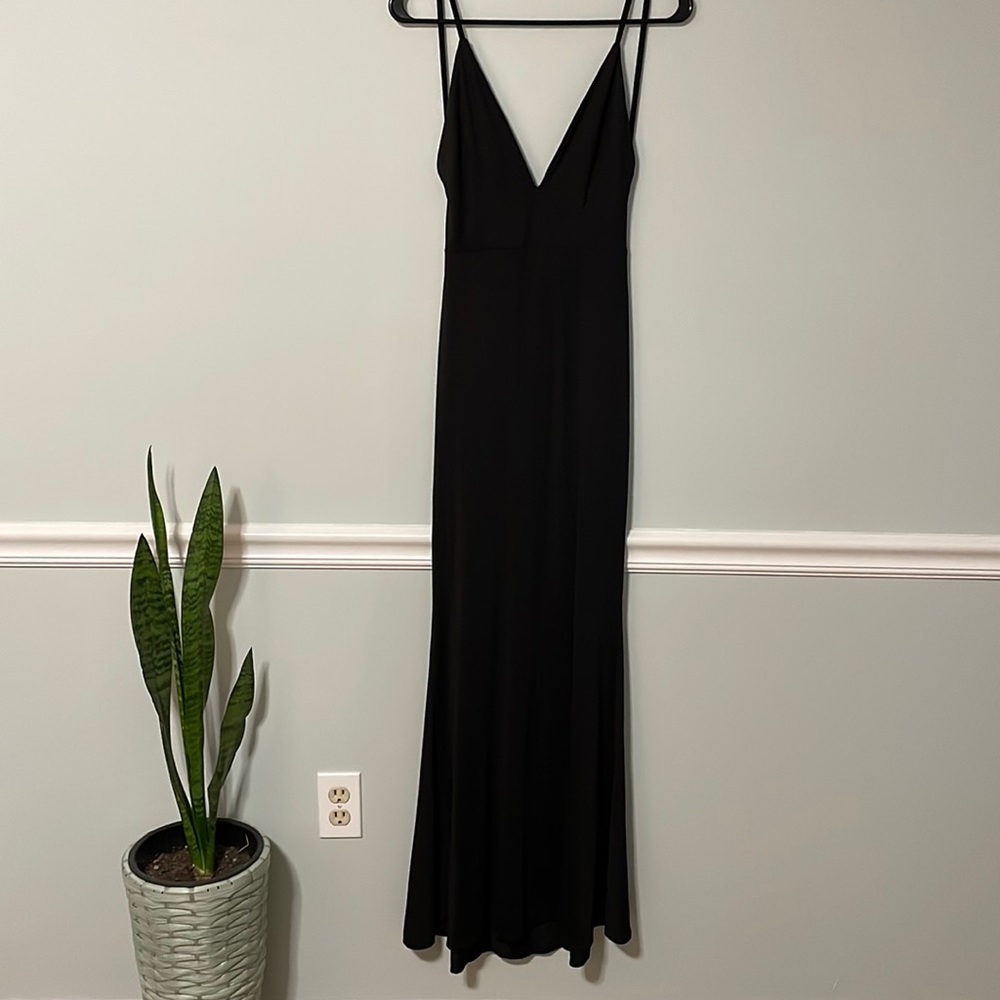 Long formal tight black dress. Very low back and scrunch on the butt. Size small